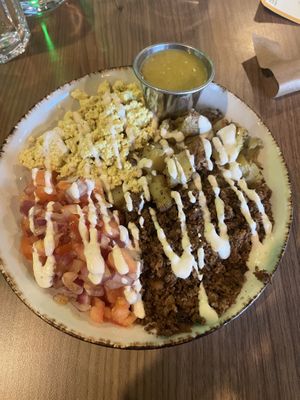 Breakfast burrito bowl! Spicy sauce  at Avo in Nashville