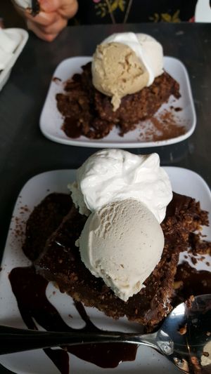 Vegan brownies topped with espresso gelato and cardamom gelato.  at Avo in Nashville