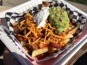 Vegan Chili Cheese Fries! Topped with Daiya cheddar, Tofutti sour cream, and guac. Amazing... at Emergency Munchie Truck in West Lafayette