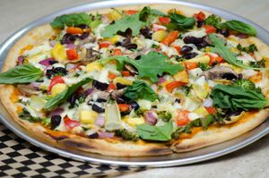 Our famous hand rolled Pizza Crust makes pizzaria pizza at home with a crisp chew texture...and served up hot at Belem's Cafe at our outlet! at Shambala Bakery and Bistro in Mount Vernon