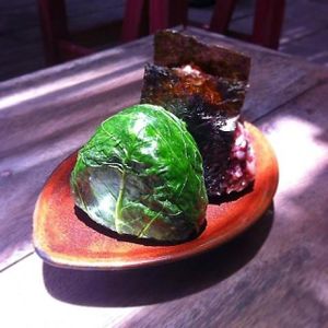 Wrapped brown rice by fermented mustard leaf  at Amrita Garden in Chiang Mai