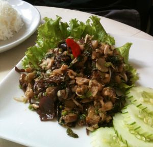 Called 'Laab Mak Keua' for 35000 kip. Grilled eggplant, mushrooms, herbs (lemon grass, garlic, galingale and a little bit of pepper), long bean and Vegetables. Served with rice.  at Indigo Cafe in Luang Prabang