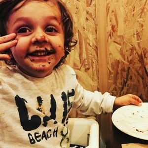 Happy child after vegan gluten free chocolate cake! at Bioveggy in Florence