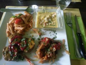 Business lunch that we had at Bioveggy - pasta al dente, mini vegi-burgers, corn soup and marinated vegetables. at Bioveggy in Florence