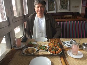 Dad and vegan plate with small dishes! at Stupa View in Kathmandu