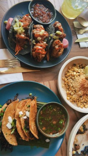 Buffalo flower taco, La Birria taco and Esquites side   at Jajaja Mexicana in Miami