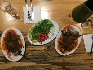 Vegan iskender and a green part of lahmacun. at Vegan Community Kitchen in Istanbul