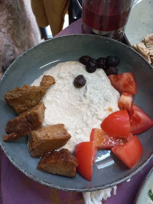 "Queso" de semillas de girasol, tomate y su seitan casero con olivas at Vegan Community Kitchen in Istanbul
