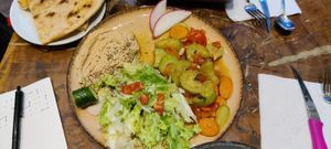 Veggie plate with zucchini, carrots, salad and hummus at Vegan Community Kitchen in Istanbul