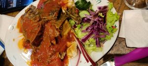 Vegan kebab with yogurt and tomato sauce at Vegan Community Kitchen in Istanbul