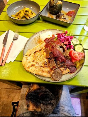 The cat might sit on you for the duration of your meal lol at Vegan Community Kitchen in Istanbul