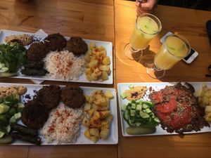 “Doner saytan kebab” with rice and potatoes, “Meatballs”, side of delicious hummus, cucumber mint salad, handmade domas. Top notch, homemade! at Vegan Community Kitchen in Istanbul