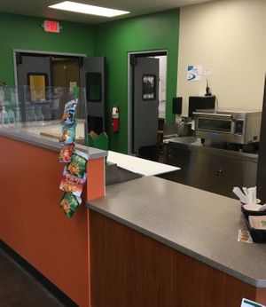 Indoor cafe with vegan menu items at Spiral Food Co-Op in Hastings