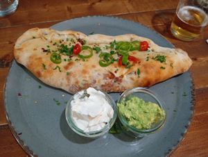 Calzone pizza with avocado and veganaise dips. at The Tree Rooms in Newcastle Upon Tyne