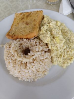 Monochromatic main plate: brown rice, tarwi, and a tofu patty at Sayel in Lima