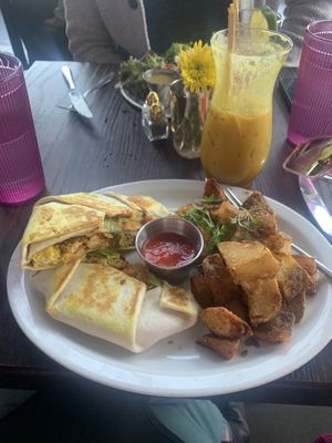 Crunchwrap with breakfast potatoes and spiked golden mylk!  at Modern Love in Omaha