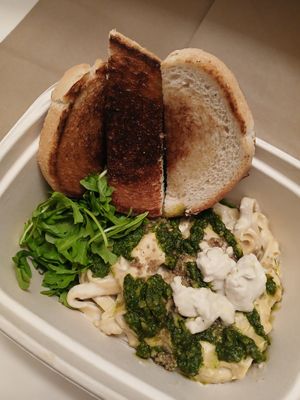 Roasted Garlic Alfredo - creamy garlic sauce, fettuccine, cashew mozzarella, pesto, arugula, pepita parmesan, garlic bread at Modern Love in Omaha