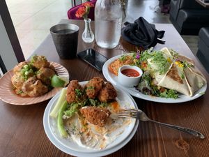Cauliflower bites, seitan boneless wings, vegan crunch wrap supreme. 10/10!  at Modern Love in Omaha