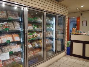 Freezer of fake meats, check to make sure it's vegan rather than vegetarian at Yuan in Montreal