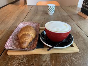 Vegan orange croissant and cappuccino with soy milk  at NaBi by Bgood in Milan
