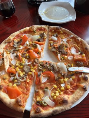 Veggie pizza without cheese. The crust is amazing and the toppings good.  at Golden Flower in Tornio