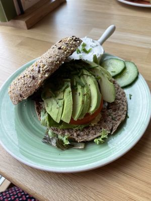 Avocado wholemeal bagel with chives vegan cream cheese 🥯   at Bagels & Beans - Veemkade in Amsterdam