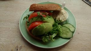 Bagel with avocado, tomato, salad and extra hummus instead of cream cheese at Bagels & Beans - Waterlooplein in Amsterdam