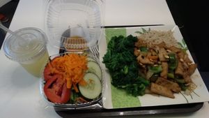 Spicy Kung Pao Rice Bowl, with side salad (with carrot ginger dressing), and lemonade at VLife in New York City