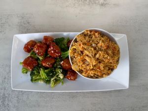 Thai Chick’n and broccoli: Savory Chick’n with a sweet and sour sauce accompanied by fried rice made with vegan egg, caramelized onion and other savory veggies.   at Aisha's Plant-Based Eatery in Miami