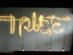 Sign on wall inside Tribe Organic at Tribe Organic - China View Plaza in Beijing