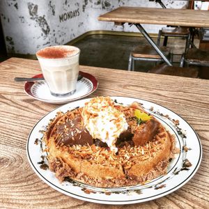 Vegan cardamom waffles with pear. Chai latte.  at Mondays in Auckland