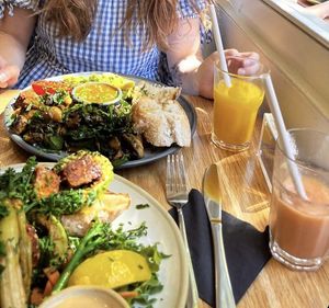 Vegan benedict with duke smoothie and vegan breakfast with orange juice  at Kin Cafe Vegetarian in London