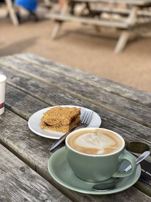 Oat cappuccino and flapjackk  at Flint Barn Cafe in Norwich