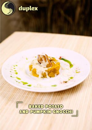 Baked Potato and Pumpkin Gnocchi with raw egg yolk and melted cheese  at Duplex in Phnom Penh