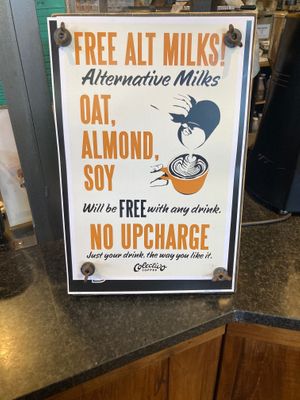 Placard in store: no vegan surcharge for plant milk! at Colectivo Coffee Evanston in Evanston
