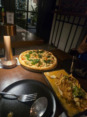 Kraprao Northern Thai Sausage Pizza is very delicious. And Banana blossom minced plantbased meat thai dressed salad is very good taste. Recommended.love it at Jay and Mangs Vegetarian Food in Bangkok