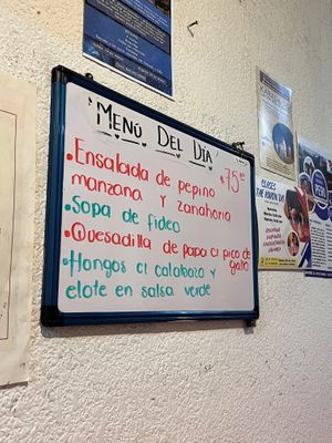 Menu of the day is written inside on this board, and also on a sandwich board in front of the unmarked restaurant door. at Comida Vegetariana in Mexico City