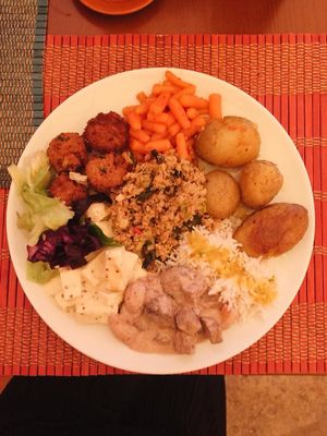Tofu in a mustard sauce, seitan, potatoes, spicy baby carrots, rice, cabbage and rice meatballs at Jardim dos Sentidos in Lisbon