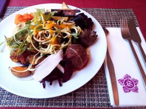 Buffet: purple onion, beet, cucumber noodles, soyball, beans (underneath), salad with mango sauce at Jardim dos Sentidos in Lisbon