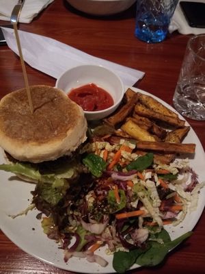The burger with almond salad and fries  at Jardim dos Sentidos in Lisbon