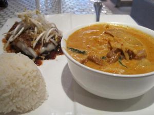 Red Curry Duck (super good) with rice and square noodle roll with black sweet chili (didn't like the sauce) at Pukk in New York City