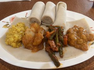 Veggie combo: Yekik Watt, Denich Watt, Fosolia, Shimbira Watt served with injira   at Blue Nile Cafe in Kansas City