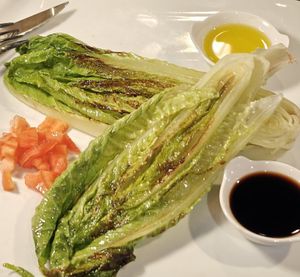 Grilled romaine hearts Caesar (vegan option substitutes the dressing and omits parm) at Ursa Kitchen in Mammoth Lakes