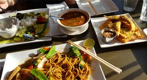 Green curry, hot and sour soup, golden triangles, vegetable noodle dish at My Thai Vegan Cafe in Boston