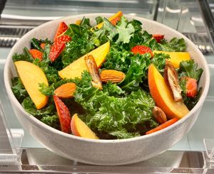 Kale and peach salad  at Craft Table - Artisan Café & Bakery in Dubai