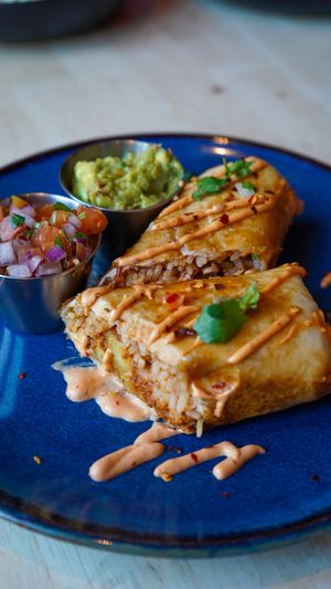 Chimichanga: filled with rice, chorixo, grilled veg, fried potato and tomatillo salsa verde - vegan, nut free   at Antojitos Cantina in Edinburgh