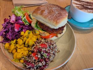 The Waterside Burger with selection of 3 salads. at Waterside Cafe in Kendal