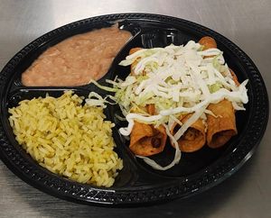 vegan taquitos, rice, beans, lettuce vegan sour cream, vegan mozzarella cheese  at Chiquito Picoso Kitchen in Moreno Valley