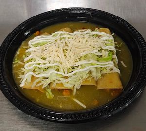 vegan enchiladas, green house sauce, vegan chicken, lettuce, vegan mozzarella cheese, vegan sour cream  at Chiquito Picoso Kitchen in Moreno Valley