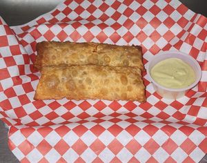 vegan egg rolls, vegan chicken 
vegan mango habanero chicken, vegan asada, teriyaki chicken, with vegan cheddar cheese, onion, cilantro   at Chiquito Picoso Kitchen in Moreno Valley